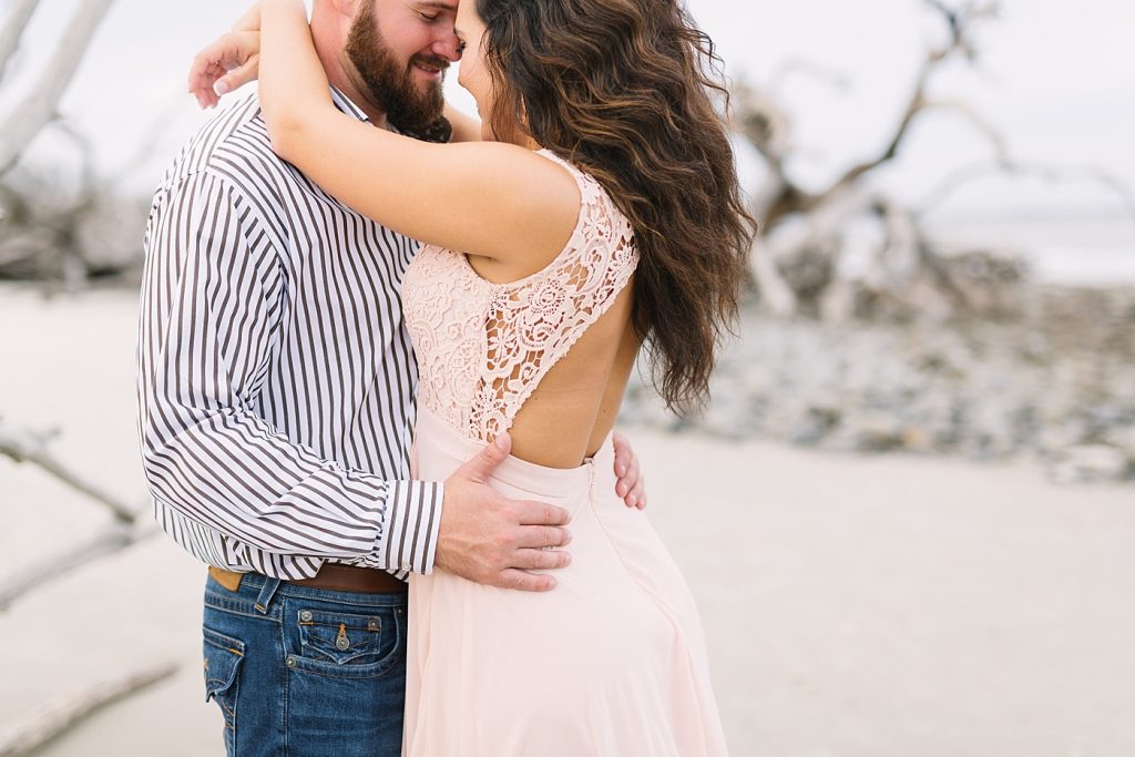 beach driftwood engagement session