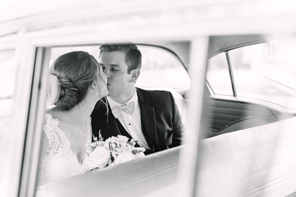 wedding getaway car kiss photo