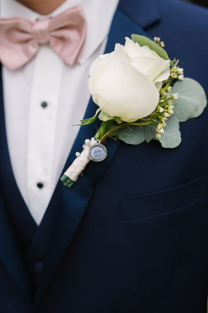 groom navy suit with blush bowtie