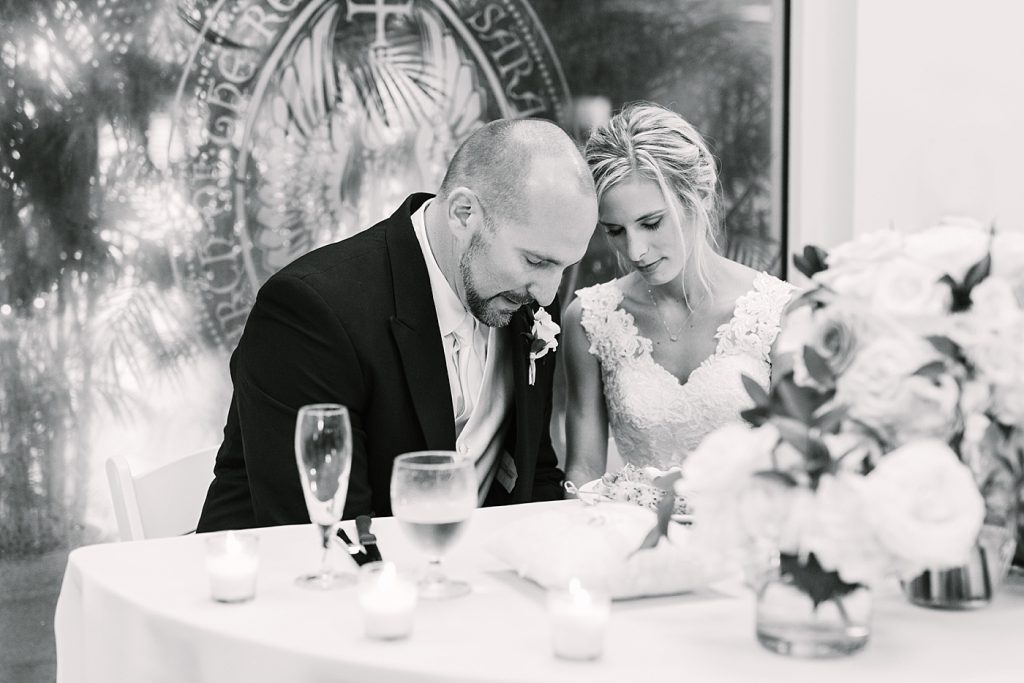 bride and groom praying at reception photos