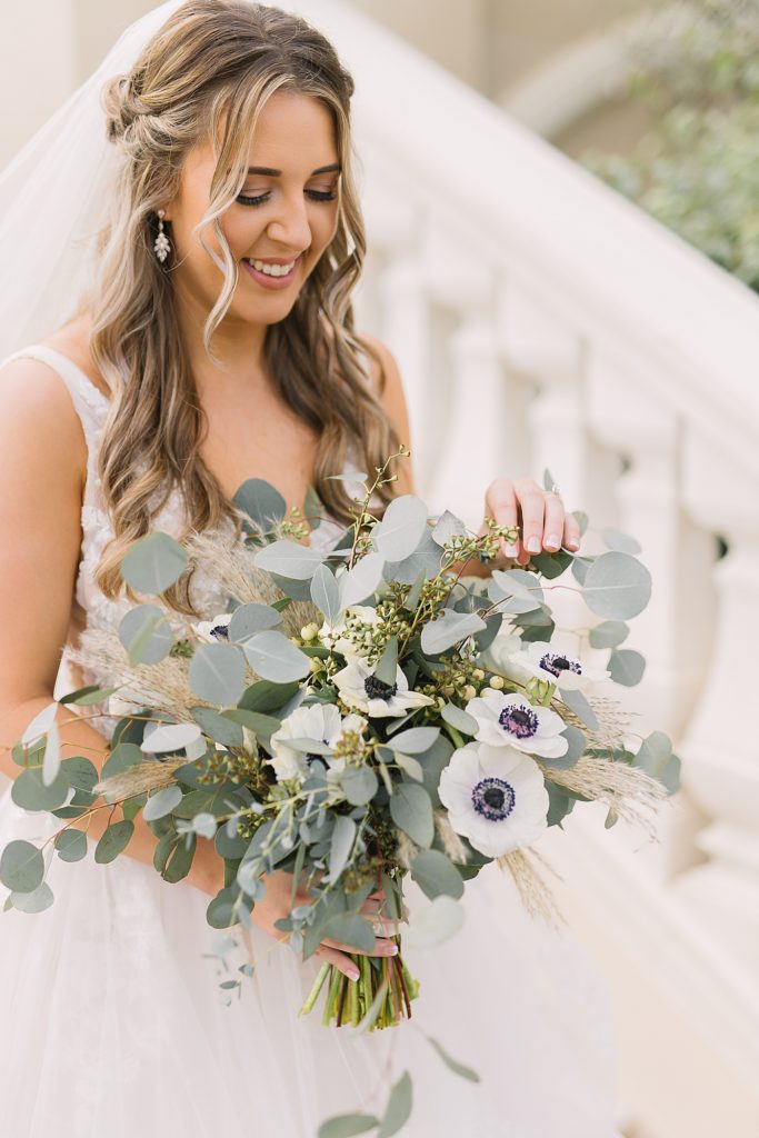 bride bouquet with eucalyptus and anemones