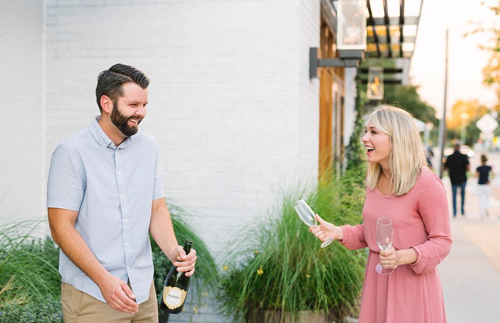 engagement photos with champagne