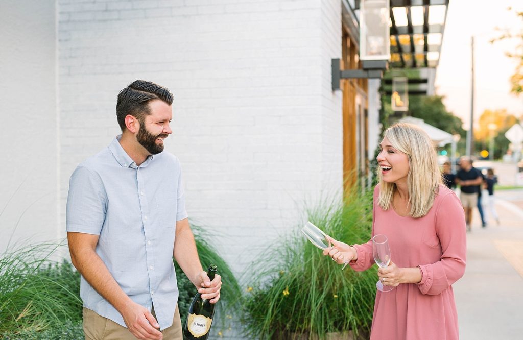 engagement photos with champagne toast